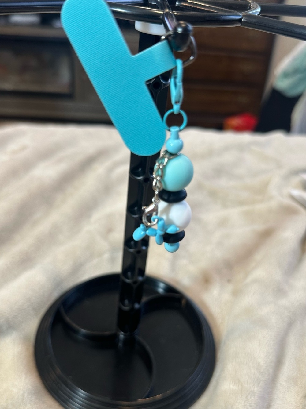 Turquoise Beaded phone charm with  Dangle balloon dog Charm